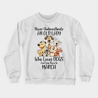 Never Underestimate An Old Lady Who Loves Dogs And Was Born In March Crewneck Sweatshirt